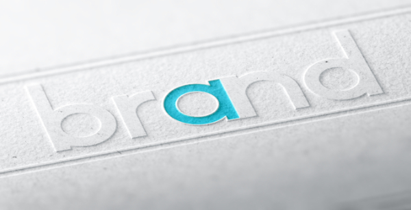 The word brand embossed on a paper background